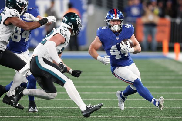 Oct 9, 2025; East Rutherford, New Jersey, USA; New York Giants running back Cam Skattebo (44) carries the ball against the Philadelphia Eagles during the second quarter of the game at MetLife Stadium. Mandatory Credit: Vincent Carchietta-Imagn Images