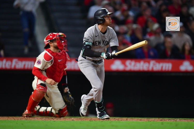May 27, 2025; Anaheim, California, USA; New York Yankees left fielder Cody Bellinger (35) hits a single against the Los Angeles Angels during the sixth inning at Angel Stadium. Credit: Gary A. Vasquez-Imagn Images