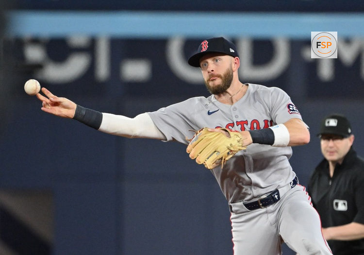 May 1, 2025; Toronto, Ontario, CAN;  Boston Red Sox shortstop Trevor Story (10) throws out Toronto Blue Jays catcher Alejandro Kirk (not shown) in the seventh inning at Rogers Centre. Credit: Dan Hamilton-Imagn Images