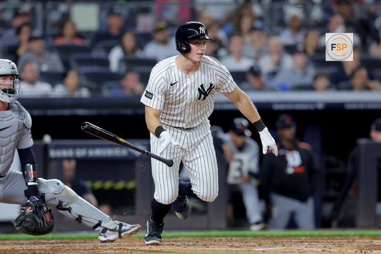 Sep 11, 2025; Bronx, New York, USA; New York Yankees catcher Ben Rice (22) follows through on an RBI double against the Detroit Tigers during the second inning at Yankee Stadium. Credit: Brad Penner-Imagn Images