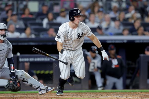 Sep 11, 2025; Bronx, New York, USA; New York Yankees catcher Ben Rice (22) follows through on an RBI double against the Detroit Tigers during the second inning at Yankee Stadium. Mandatory Credit: Brad Penner-Imagn Images