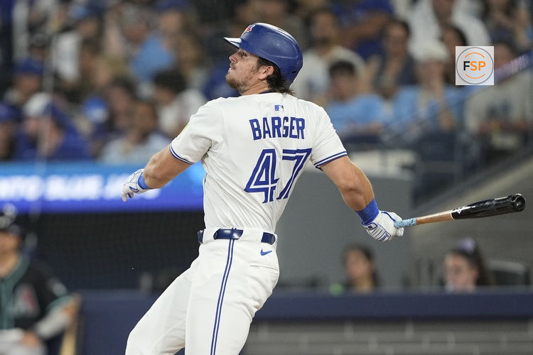 Jun 18, 2025; Toronto, Ontario, CAN; Toronto Blue Jays right fielder Addison Barger (47) hits a single against the Arizona Diamondbacks during the fifth inning at Rogers Centre. Credit: John E. Sokolowski-Imagn Images