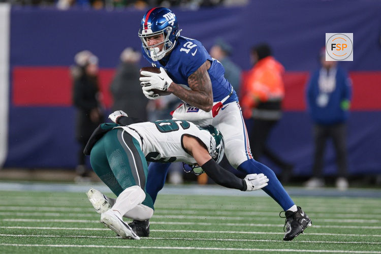Jan 7, 2024; East Rutherford, New Jersey, USA; New York Giants tight end Darren Waller (12) is tackled by Philadelphia Eagles safety Tristin McCollum (36) during the second half at MetLife Stadium. Credit: Vincent Carchietta-USA TODAY Sports