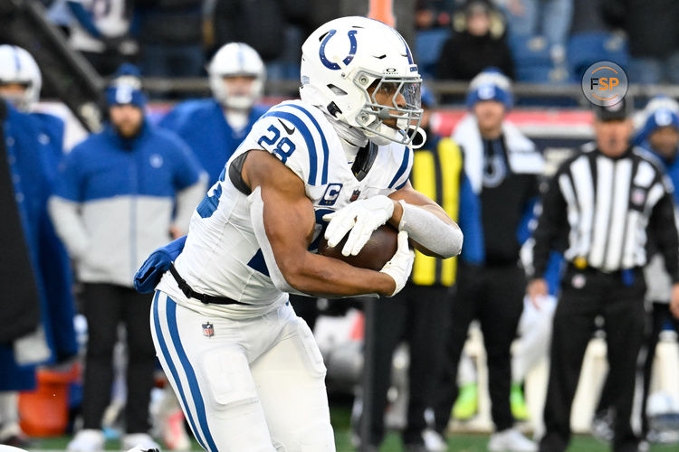 Dec 1, 2024; Foxborough, Massachusetts, USA; Indianapolis Colts running back Jonathan Taylor (28) runs the ball during the second half against the New England Patriots at Gillette Stadium. Credit: Eric Canha-Imagn Images