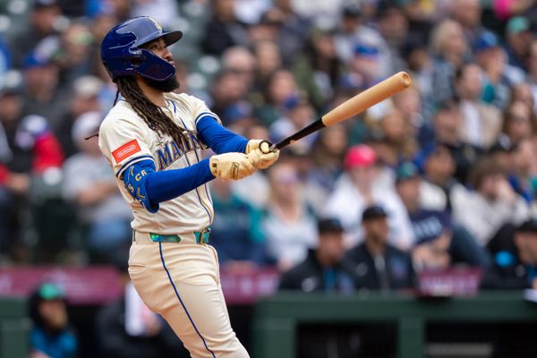 Apr 27, 2025; Seattle, Washington, USA;  Seattle Mariners shortstop J.P. Crawford (3) hits a home run against the Miami Marlins at T-Mobile Park. Mandatory Credit: Stephen Brashear-Imagn Images