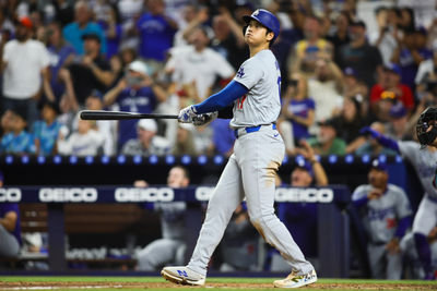 Sep 19, 2024; Miami, Florida, USA; Los Angeles Dodgers designated hitter Shohei Ohtani (17) hits a two-run home run against the Miami Marlins during the seventh inning at loanDepot Park. Mandatory Credit: Sam Navarro-Imagn Images