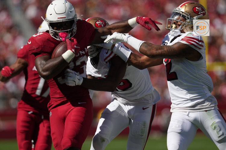 Sep 21, 2025; Santa Clara, California, USA; Arizona Cardinals running back Trey Benson (33) carries the ball as San Francisco 49ers safety Jason Pinnock (25) defends during the second half at Levi's Stadium. Credit: Cary Edmondson-Imagn Images