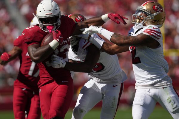 Sep 21, 2025; Santa Clara, California, USA; Arizona Cardinals running back Trey Benson (33) carries the ball as San Francisco 49ers safety Jason Pinnock (25) defends during the second half at Levi's Stadium. Mandatory Credit: Cary Edmondson-Imagn Images
