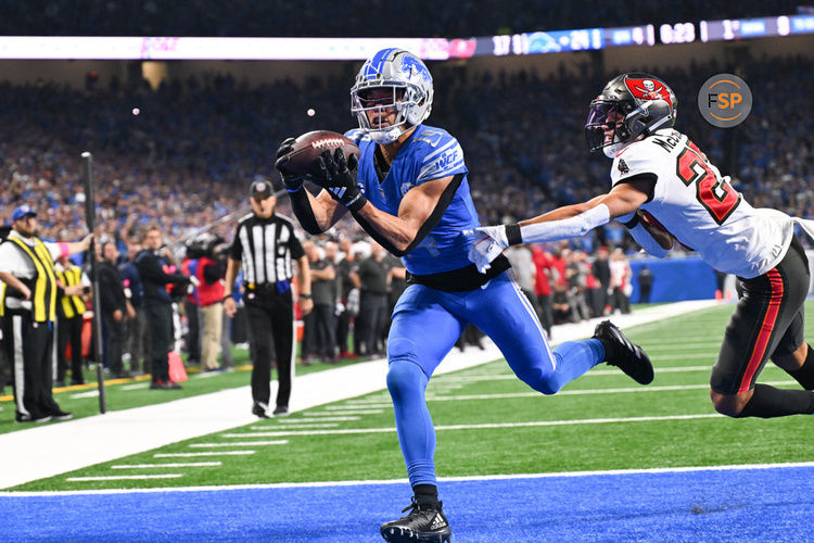 DETROIT, MI - JANUARY 21: Detroit Lions wide receiver Amon-Ra St. Brown (14) makes an over the shoulder touchdown catch during the NFC Divisional playoff game between the Detroit Lions and the Tampa Bay Buccaneers on Sunday January 21, 2023 at Ford Field in Detroit, MI. (Photo by Steven King/Icon Sportswire)