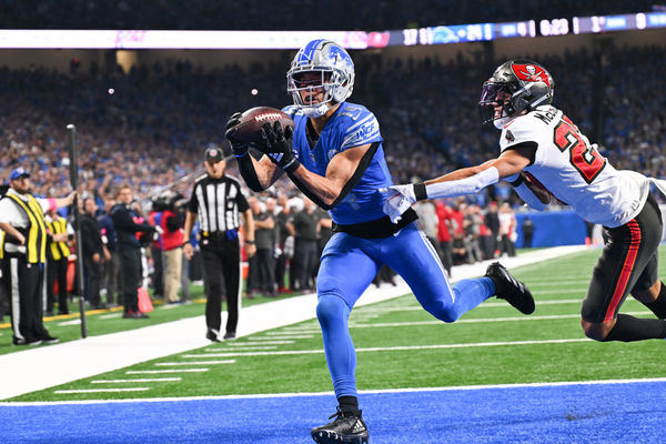 DETROIT, MI - JANUARY 21: Detroit Lions wide receiver Amon-Ra St. Brown (14) makes an over the shoulder touchdown catch during the NFC Divisional playoff game between the Detroit Lions and the Tampa Bay Buccaneers on Sunday January 21, 2023 at Ford Field in Detroit, MI. (Photo by Steven King/Icon Sportswire)