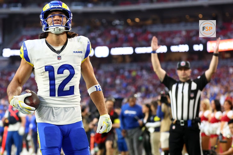 Dec 7, 2025; Glendale, Arizona, USA; Los Angeles Rams wide receiver Puka Nacua (12) makes a catch for a touchdown against the Arizona Cardinals during the second half at State Farm Stadium. Credit: Mark J. Rebilas-Imagn Images