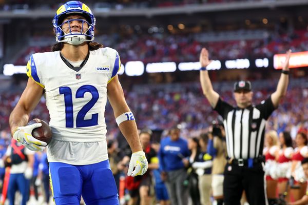Dec 7, 2025; Glendale, Arizona, USA; Los Angeles Rams wide receiver Puka Nacua (12) makes a catch for a touchdown against the Arizona Cardinals during the second half at State Farm Stadium. Mandatory Credit: Mark J. Rebilas-Imagn Images
