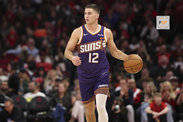 Dec 5, 2025; Houston, Texas, USA; Phoenix Suns guard Collin Gillespie (12) dribbles the ball during the fourth quarter against the Houston Rockets at Toyota Center. Credit: Troy Taormina-Imagn Images