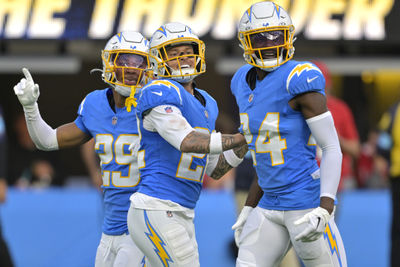 Dec 15, 2024; Inglewood, California, USA;  Los Angeles Chargers cornerback Elijah Molden (22) celebrates with cornerback Tarheeb Still (29) and defensive tackle Scott Matlock (44) after a fumble recovery in the first half against the Tampa Bay Buccaneers at SoFi Stadium. Mandatory Credit: Jayne Kamin-Oncea-Imagn Images