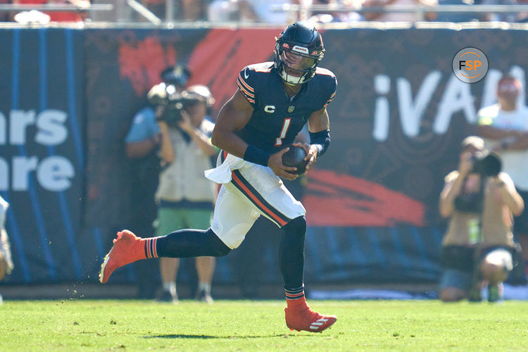 CHICAGO, IL - OCTOBER 01: Chicago Bears quarterback Justin Fields (1) runs with the football in action during a game between the Chicago Bears and the Denver Broncos on October 01, 2023 at Soldier Field in Chicago, IL. (Photo by Robin Alam/Icon Sportswire)