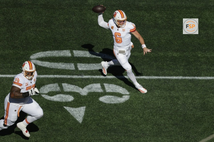 Oct 5, 2025; Seattle, Washington, USA; Tampa Bay Buccaneers quarterback Baker Mayfield (6) looks downfield as offensive tackle Tristan Wirfs (78) looks to block during the first half against the Seattle Seahawks at Lumen Field. Credit: Joe Nicholson-Imagn Images