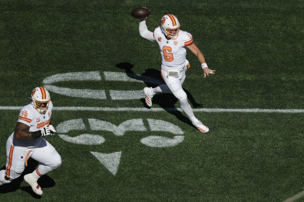 Oct 5, 2025; Seattle, Washington, USA; Tampa Bay Buccaneers quarterback Baker Mayfield (6) looks downfield as offensive tackle Tristan Wirfs (78) looks to block during the first half against the Seattle Seahawks at Lumen Field. Mandatory Credit: Joe Nicholson-Imagn Images