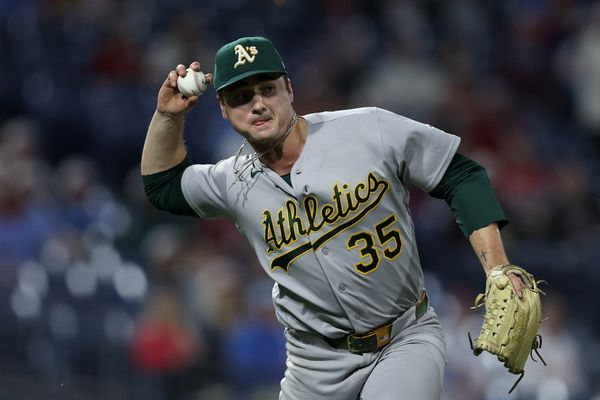 May 7, 2026; Philadelphia, Pennsylvania, USA; Athletics pitcher J.T. Ginn (35) is unable to throw out Philadelphia Phillies center fielder Justin Crawford (not pictured) on his single during the eighth inning at Citizens Bank Park. Mandatory Credit: Bill Streicher-Imagn Images