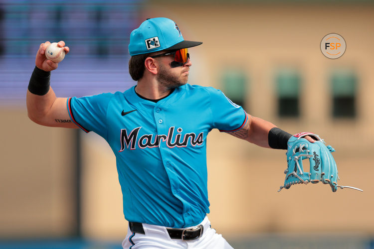 Feb 26, 2025; Jupiter, Florida, USA; Miami Marlins third baseman Connor Norby (1) throws to first base and retires New York Mets designated hitter Chris Williams (not pictured) during the third inning at Roger Dean Chevrolet Stadium. Credit: Sam Navarro-Imagn Images