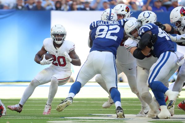 Oct 12, 2025; Indianapolis, Indiana, USA; Arizona Cardinals running back Bam Knight (20) carries the ball against the Indianapolis Colts during the second half of the game at Lucas Oil Stadium. Mandatory Credit: Trevor Ruszkowski-Imagn Images
