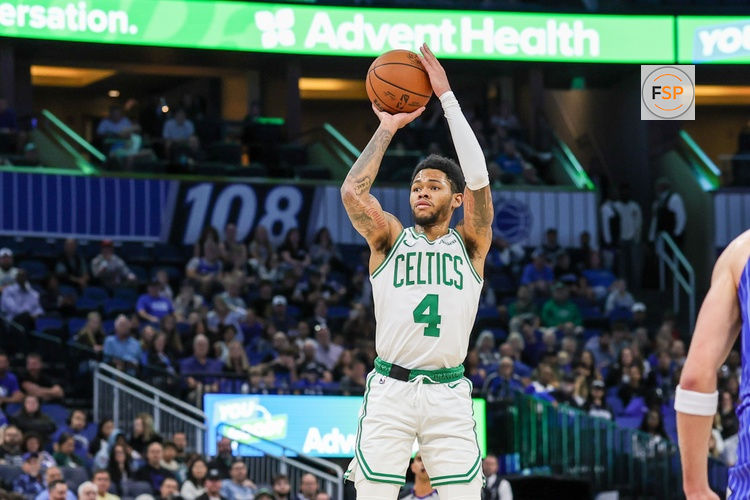 Nov 9, 2025; Orlando, Florida, USA; Boston Celtics guard Anfernee Simons (4) shoots a three point basket during the second quarter against the Orlando Magic at Kia Center. Credit: Mike Watters-Imagn Images