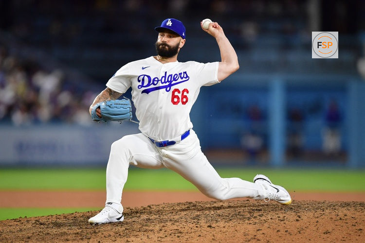 Jul 8, 2026; Los Angeles, California, USA; Los Angeles Dodgers pitcher Tanner Scott (66) throws against the Colorado Rockies during the ninth inning at Dodger Stadium. Credit: Gary A. Vasquez-Imagn Images