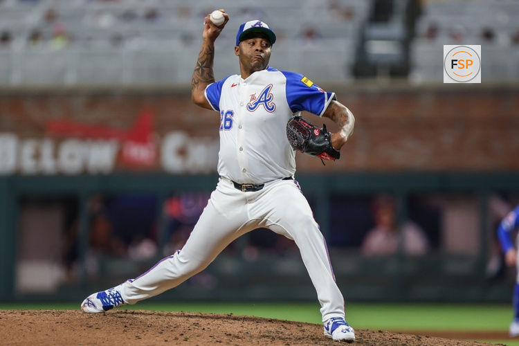 Sep 27, 2025; Cumberland, Georgia, USA; Atlanta Braves pitcher Raisel Iglesias (26) pitches the ball against the Pittsburgh Pirates during the ninth inning at Truist Park. Credit: Jordan Godfree-Imagn Images