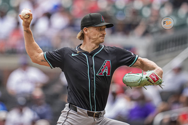 Jun 5, 2025; Cumberland, Georgia, USA; Arizona Diamondbacks relief pitcher Shelby Miller (18) pitches against the Atlanta Braves during the ninth inning at Truist Park. Credit: Dale Zanine-Imagn Images