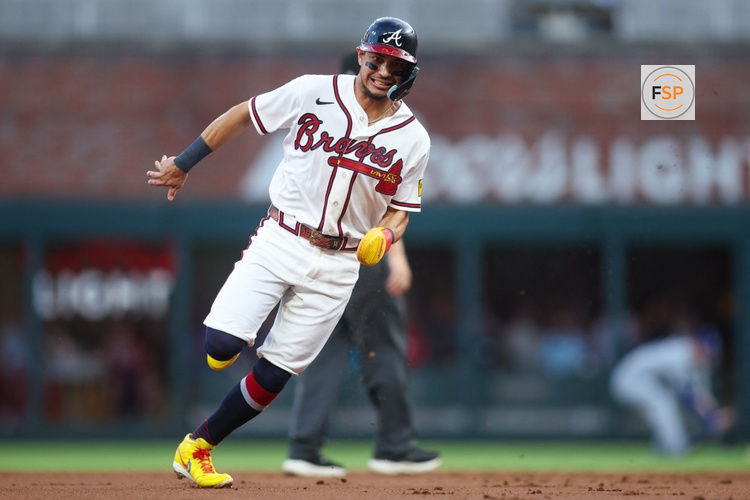 Aug 25, 2026; Atlanta, Georgia, USA; Atlanta Braves shortstop Mauricio Dubon (14) runs to third against the Los Angeles Dodgers in the first inning at Truist Park. Credit: Brett Davis-Imagn Images
