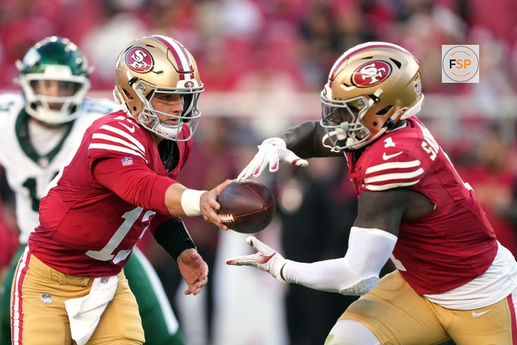 Sep 9, 2024; Santa Clara, California, USA; San Francisco 49ers quarterback Brock Purdy (left) hands off to wide receiver Deebo Samuel Sr. (right) during the second quarter against the New York Jets at Levi's Stadium. Credit: Darren Yamashita-Imagn Images