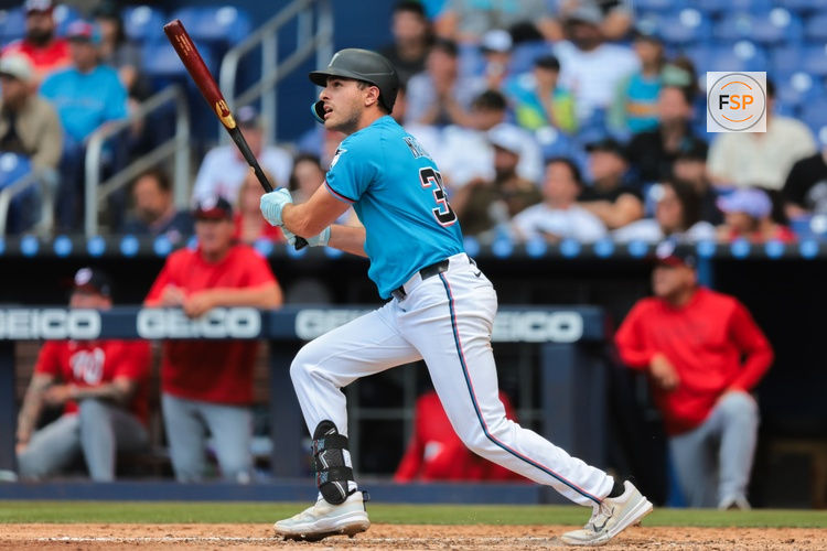 Apr 13, 2025; Miami, Florida, USA; Miami Marlins pinch hitter Matt Mervis (36) hits a three-run home run against the Washington Nationals during the seventh inning at loanDepot Park. Credit: Sam Navarro-Imagn Images