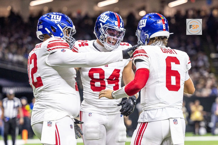 Oct 5, 2025; New Orleans, Louisiana, USA;  New York Giants tight end Theo Johnson (84) and quarterback Jaxson Dart (6) react to a touchdown against New Orleans Saints during the first half at Caesars Superdome. Credit: Stephen Lew-Imagn Images