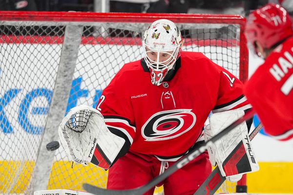 Dec 9, 2025; Raleigh, North Carolina, USA;  Carolina Hurricanes goaltender Brandon Bussi (32) watches the shot during the warmups before the game against the Columbus Blue Jackets at Lenovo Center. Mandatory Credit: James Guillory-Imagn Images