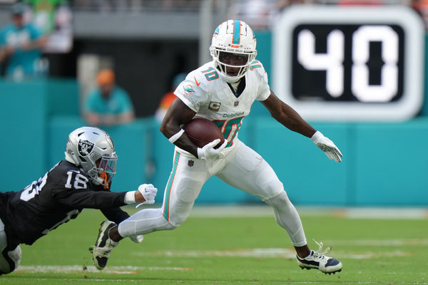 MIAMI GARDENS, FL - NOVEMBER 19: Miami Dolphins wide receiver Tyreek Hill (10) runs after a catch during the game between the Las Vegas Raiders and the Miami Dolphins on Sunday, November 19, 2023 at Hard Rock Stadium, Miami, Fla. (Photo by Peter Joneleit/Icon Sportswire)