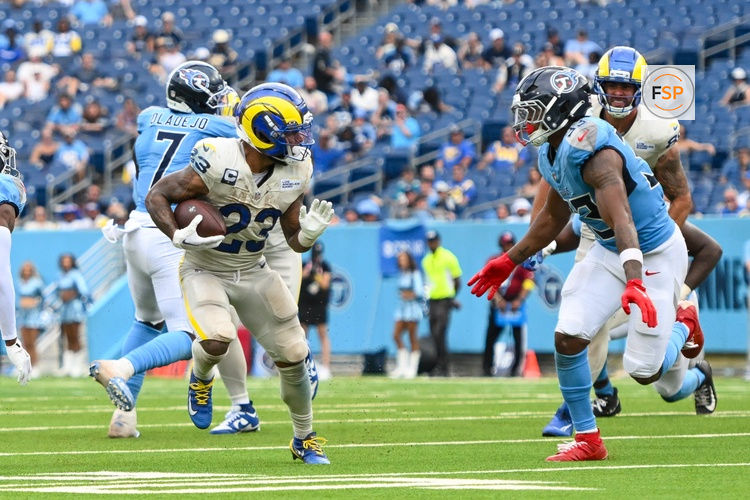 Sep 14, 2025; Nashville, Tennessee, USA;  Los Angeles Rams running back Kyren Williams (23) runs with the ball against the Tennessee Titans during the second half at Nissan Stadium. Credit: Steve Roberts-Imagn Images