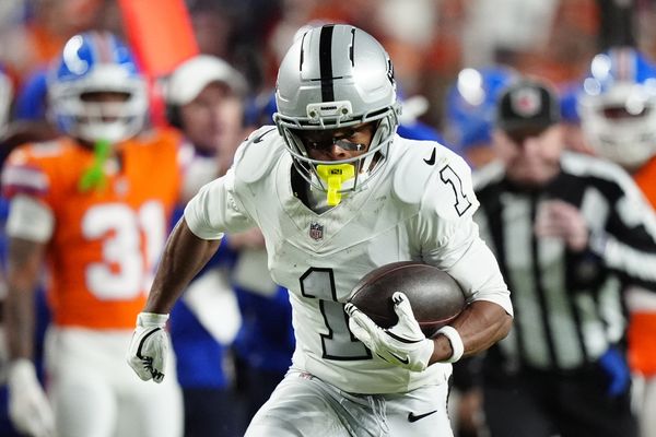 Nov 6, 2025; Denver, Colorado, USA; Las Vegas Raiders wide receiver Tre Tucker (1) runs with the ball after catch against the Denver Broncos during the first half at Empower Field at Mile High. Mandatory Credit: Ron Chenoy-Imagn Images