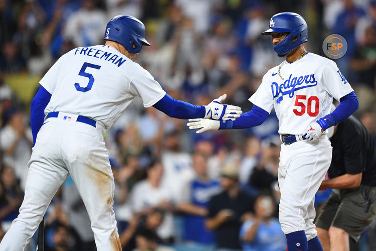 LOS ANGELES, CA - JULY 07: Los Angeles Dodgers second baseman Mookie Betts (50) is greeted by Los Angeles Dodgers first baseman Freddie Freeman (5) after his second home run in the MLB game between the Los Angeles Angels and the Los Angeles Dodgers on July 7, 2023 at Dodger Stadium in Los Angeles, CA. (Photo by Brian Rothmuller/Icon Sportswire)