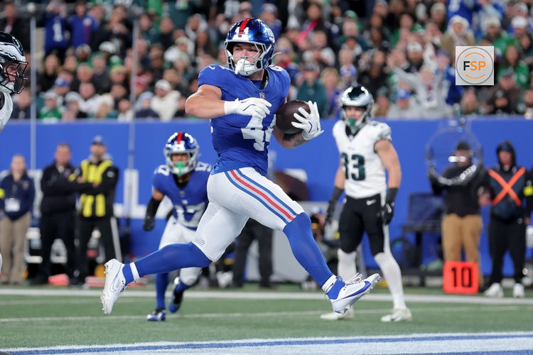 Oct 9, 2025; East Rutherford, New Jersey, USA; New York Giants running back Cam Skattebo (44) scores a touchdown against the Philadelphia Eagles during the second quarter at MetLife Stadium. Credit: Brad Penner-Imagn Images