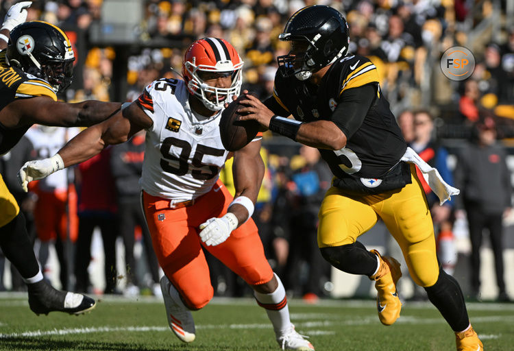 Dec 8, 2024; Pittsburgh, Pennsylvania, USA; Pittsburgh Steelers quarterback Russell Wilson (3) is chased by Cleveland Browns defensive end Myles Garrett (95) during the first quarter at Acrisure Stadium. Credit: Barry Reeger-Imagn Images