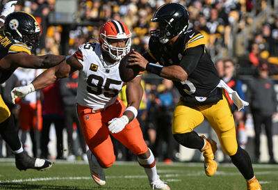 Dec 8, 2024; Pittsburgh, Pennsylvania, USA; Pittsburgh Steelers quarterback Russell Wilson (3) is chased by Cleveland Browns defensive end Myles Garrett (95) during the first quarter at Acrisure Stadium. Mandatory Credit: Barry Reeger-Imagn Images