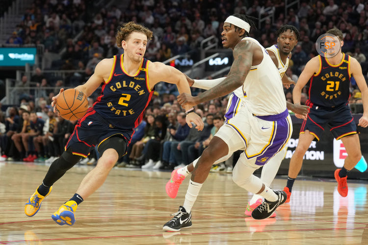 Jan 25, 2025; San Francisco, California, USA; Golden State Warriors guard Brandin Podziemski (2) dribbles against Los Angeles Lakers forward Jarred Vanderbilt (center right) during the fourth quarter at Chase Center. Credit: Darren Yamashita-Imagn Images