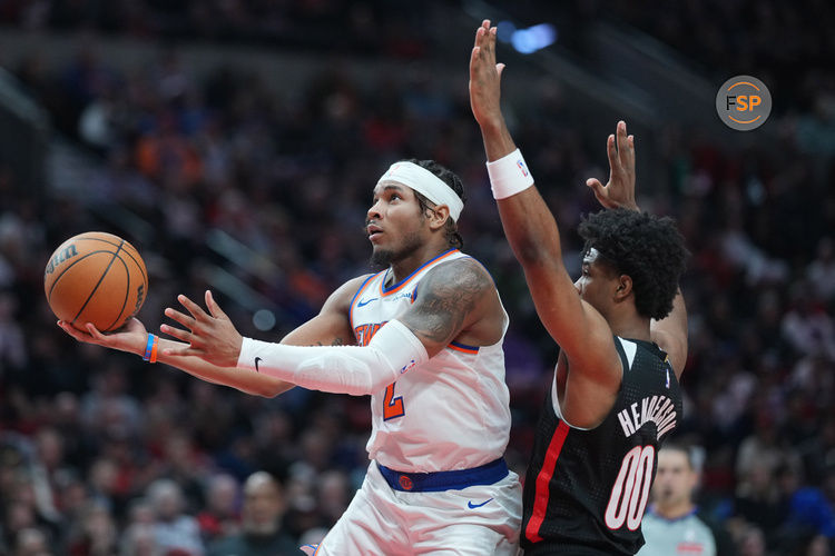 Mar 12, 2025; Portland, Oregon, USA; New York Knicks point guard Miles McBride (2) shoots the ball against Portland Trail Blazers guard Scoot Henderson (00) during the second half at Moda Center. Credit: Soobum Im-Imagn Images