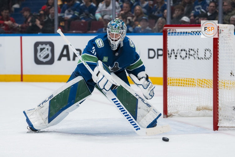 Mar 15, 2025; Vancouver, British Columbia, CAN; Vancouver Canucks goalie Arturs Silovs (31) handles the puck against the Chicago Blackhawks in the second period at Rogers Arena. Credit: Bob Frid-Imagn Images