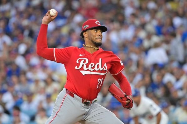 Sep 30, 2025; Los Angeles, California, USA; Cincinnati Reds starting pitcher Hunter Greene (21) throws a pitch during the first inning against the Los Angeles Dodgers during game one of the Wildcard round for the 2025 MLB playoffs at Dodger Stadium. Mandatory Credit: Jayne Kamin-Oncea-Imagn Images