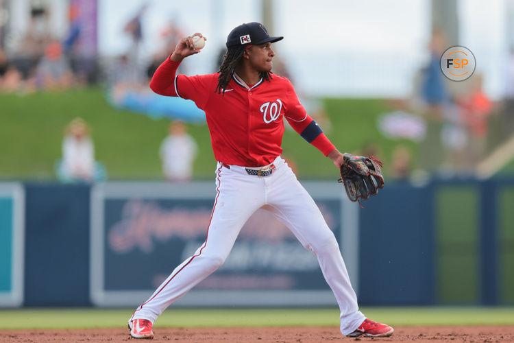 Feb 23, 2025; West Palm Beach, Florida, USA; Washington Nationals shortstop CJ Abrams (5) throws to first base to retire New York Mets second baseman Jett Williams (not pictured) during the second inning at CACTI Park of the Palm Beaches. Credit: Sam Navarro-Imagn Images