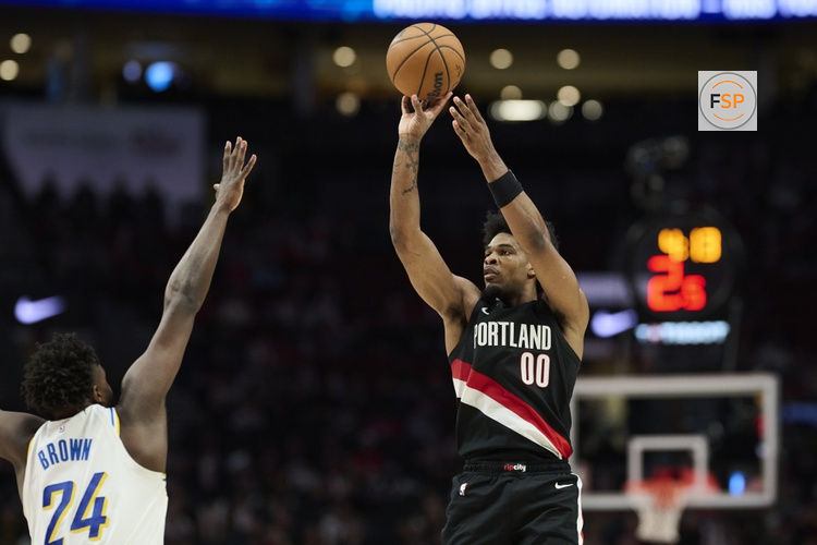 Mar 8, 2026; Portland, Oregon, USA; Portland Trail Blazers guard Scoot Henderson (00) shoots a jump shot during the second half against Indiana Pacers guard Kobe Brown (24) at Moda Center. Credit: Troy Wayrynen-Imagn Images