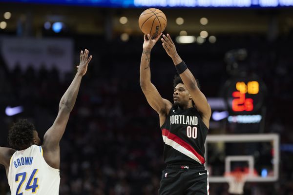 Mar 8, 2026; Portland, Oregon, USA; Portland Trail Blazers guard Scoot Henderson (00) shoots a jump shot during the second half against Indiana Pacers guard Kobe Brown (24) at Moda Center. Mandatory Credit: Troy Wayrynen-Imagn Images