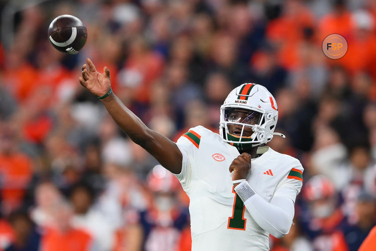 Nov 30, 2024; Syracuse, New York, USA; Miami Hurricanes quarterback Cam Ward (1) passes the ball against the Syracuse Orange during the first half at the JMA Wireless Dome. Credit: Rich Barnes-Imagn Images