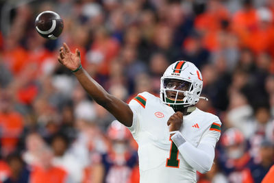 Nov 30, 2024; Syracuse, New York, USA; Miami Hurricanes quarterback Cam Ward (1) passes the ball against the Syracuse Orange during the first half at the JMA Wireless Dome. Mandatory Credit: Rich Barnes-Imagn Images