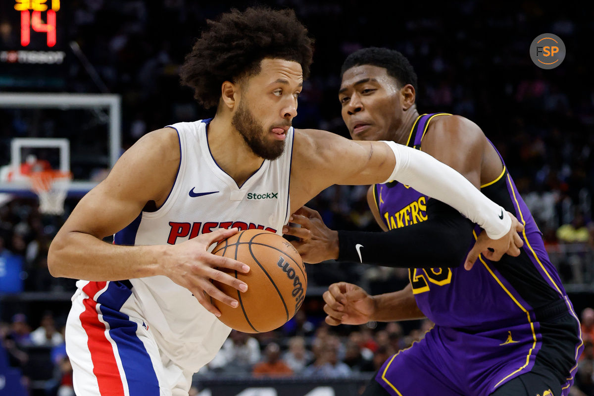 Nov 4, 2024; Detroit, Michigan, USA;  Detroit Pistons guard Cade Cunningham (2) dribbles defended by Los Angeles Lakers forward Rui Hachimura (28) in the second half at Little Caesars Arena. Credit: Rick Osentoski-Imagn Images